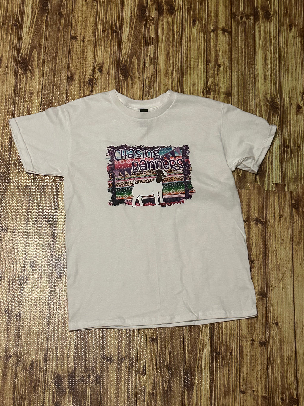 Youth Chasing Banners-Goat